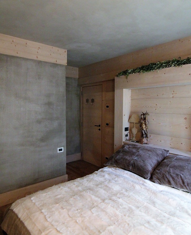 wood and concrete bedroom